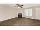 Inviting living room featuring a corner fireplace, wood-look tile flooring, and neutral walls at 611 Shadow Valley Ct, Lithonia, GA 30058