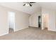 Large main bedroom with vaulted ceiling, carpet, and walk-in closet at 611 Shadow Valley Ct, Lithonia, GA 30058