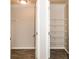 Two storage areas, one with wire shelving and one with wood-style flooring at 611 Shadow Valley Ct, Lithonia, GA 30058