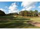 Golf course with pond and sand traps at 210 Huiet Dr, Mcdonough, GA 30252