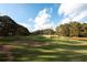Picturesque golf course with water features and trees at 210 Huiet Dr, Mcdonough, GA 30252