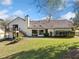 Back of house showcasing deck, landscaping, and yard at 3373 Northumberland Pl, Roswell, GA 30075