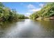 Serene lake view with lush trees at 3373 Northumberland Pl, Roswell, GA 30075