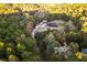 Aerial view of a home nestled in a wooded area, showcasing its secluded setting at 2260 Wilzman Trl, Conyers, GA 30012