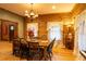 Bright dining room featuring a rustic wooden table and chandelier at 2260 Wilzman Trl, Conyers, GA 30012