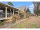 Side view of the house, showcasing the porch and yard at 3585 Pointer Rd, Loganville, GA 30052