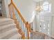 Grand staircase showcasing a beautiful chandelier and high ceilings at 2095 Jessica Way, Conyers, GA 30012