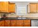 Modern kitchen with dark countertops and double sink at 2095 Jessica Way, Conyers, GA 30012