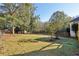 Large grassy backyard with mature trees at 1431 Brandy Shoals Se Ct, Conyers, GA 30013