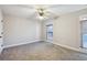 Well-lit bedroom with ceiling fan and ample space at 1431 Brandy Shoals Se Ct, Conyers, GA 30013