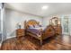 Spacious bedroom with hardwood floors and en-suite bathroom at 284 Regal Dr, Lawrenceville, GA 30046