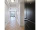 Bright entryway with tile floors leading to living area and balcony at 285 Centennial Olympic Park Nw Dr # 903, Atlanta, GA 30313