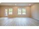 Bright living room featuring hardwood floors and multiple windows at 4192 Waratah Way, Mableton, GA 30126