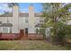 Townhouse exterior with deck and grassy yard at 3187 Kingswood Gln, Decatur, GA 30034