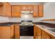 Kitchen with wood cabinets, stove and dishwasher at 3187 Kingswood Gln, Decatur, GA 30034