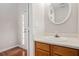 Simple bathroom with vanity and a round mirror at 3187 Kingswood Gln, Decatur, GA 30034