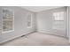 Bright bedroom with neutral walls and carpet at 3187 Kingswood Gln, Decatur, GA 30034