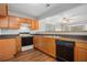Kitchen with wood cabinets, granite countertop and dishwasher at 3187 Kingswood Gln, Decatur, GA 30034