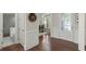 Inviting entryway with hardwood floors and access to a powder room at 323 Harvest View Ter, Woodstock, GA 30188