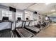 Modern fitness center with treadmills, ellipticals, and weight machines at 795 Hammond Dr # 2012, Atlanta, GA 30328