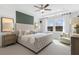 Spacious main bedroom with plush carpet and large windows offering natural light at 386 Village Ln, Fairburn, GA 30213