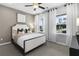 Well-lit bedroom with a queen-size bed and large windows at 386 Village Ln, Fairburn, GA 30213
