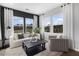 Cozy sitting room with large windows, offering ample natural light at 386 Village Ln, Fairburn, GA 30213