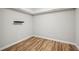 Empty room with hardwood floors, ready for your personal touch at 1428 Sparkling Cove Dr, Buford, GA 30518