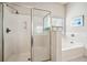 Bathroom with shower and garden tub at 1428 Sparkling Cove Dr, Buford, GA 30518