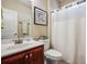 Clean bathroom with a toilet, sink, and shower at 1428 Sparkling Cove Dr, Buford, GA 30518