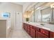 Elegant bathroom with double vanity and large mirror at 1428 Sparkling Cove Dr, Buford, GA 30518