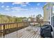 Wooden deck with patio furniture and built-in grill at 1428 Sparkling Cove Dr, Buford, GA 30518