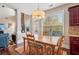 Bright dining area with hardwood floors and view to Gathering room at 1428 Sparkling Cove Dr, Buford, GA 30518