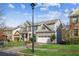 Two-story house with a three-car garage, well-maintained lawn, and mature trees at 1428 Sparkling Cove Dr, Buford, GA 30518