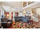 Two-story Gathering room with hardwood floors, stone fireplace, and open floor plan at 1428 Sparkling Cove Dr, Buford, GA 30518