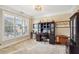 Bright home office with built-in cabinetry and large window at 1428 Sparkling Cove Dr, Buford, GA 30518