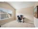 Bright home office features a large window, carpet flooring, and workspace at 1428 Sparkling Cove Dr, Buford, GA 30518