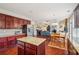 Spacious kitchen with granite countertops and dark wood cabinets at 1428 Sparkling Cove Dr, Buford, GA 30518