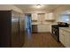 Modern kitchen with stainless steel appliances and white cabinets at 1885 Broad Ave, East Point, GA 30344