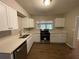 Updated kitchen with white cabinets and quartz countertops at 1885 Broad Ave, East Point, GA 30344