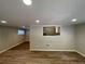 Open living area with hardwood floors and kitchen pass-through at 1885 Broad Ave, East Point, GA 30344