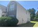 Two-story house with stone and siding accents, showcasing a large window and landscaping at 2118 Water Mill Ct, Buford, GA 30519