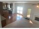 Open concept kitchen and living area with hardwood floors at 2118 Water Mill Ct, Buford, GA 30519