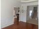 Dining room with hardwood floors, chandelier, and views to Gathering room and stairs at 2118 Water Mill Ct, Buford, GA 30519