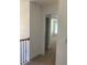 A view down a hallway with carpet and doors to bedrooms at 2118 Water Mill Ct, Buford, GA 30519