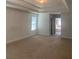 Main bedroom with high ceilings and access to bathroom at 2118 Water Mill Ct, Buford, GA 30519