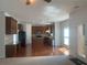 Open concept kitchen with island, stainless steel appliances, and hardwood floors at 2118 Water Mill Ct, Buford, GA 30519