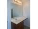 Well-lit bathroom with a vanity and large mirror at 2118 Water Mill Ct, Buford, GA 30519