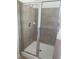 Bathroom with a large tiled shower and a frameless glass door at 2118 Water Mill Ct, Buford, GA 30519