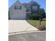 Two-story house with two-car garage and landscaping at 2118 Water Mill Ct, Buford, GA 30519